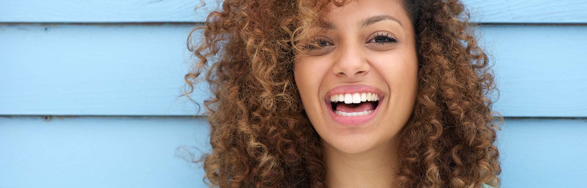 Beautiful woman smiling after Root Canal Therapy
