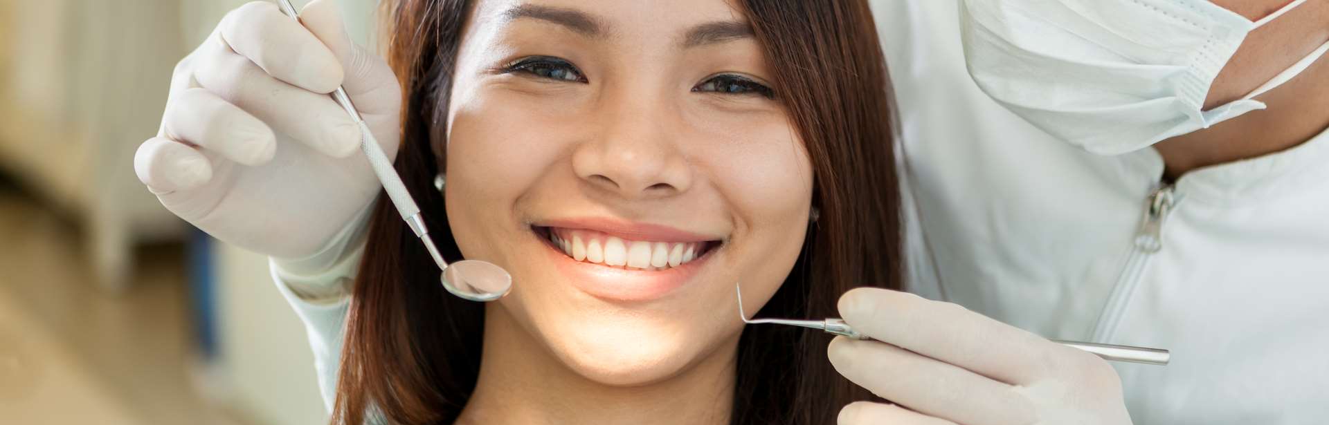 Beautiful woman smiling after Dental Emergencies treatment